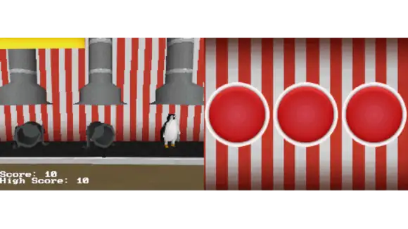 Screenshot de JamClown montrant une chaîne de production industrielle dans un décor de cirque, il y a un manchot à côté de deux canons